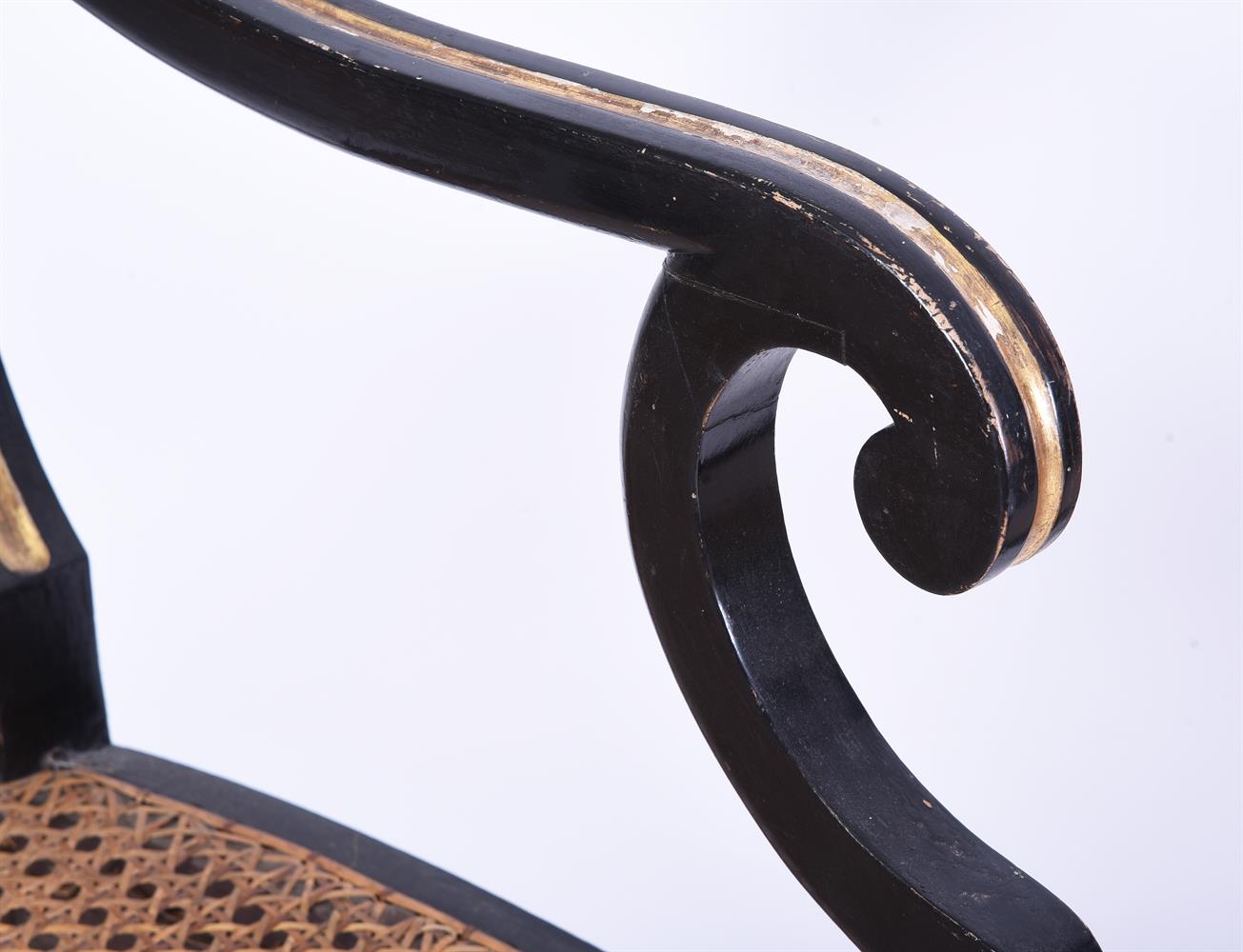 A PAIR OF REGENCY EBONISED AND PARCEL GILT OPEN ARMCHAIRS, IN THE MANNER OF JOHN GEE - Image 6 of 6