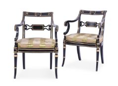 A PAIR OF REGENCY EBONISED AND PARCEL GILT OPEN ARMCHAIRS, IN THE MANNER OF JOHN GEE