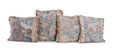 A GROUP OF FOUR TAPESTRY CUSHIONS, INCORPORATING 17TH CENTURY TAPESTRY BORDER FRAGMENTS