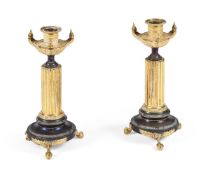 A PAIR OF EMPIRE BRONZE AND ORMOLU CANDLE HOLDERS, FRENCH, CIRCA 1820