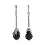 A PAIR OF ONYX AND DIAMOND DROP EARRINGS