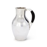 Y GEORG JENSEN, A DANISH SILVER COLOURED WATER JUG OR PITCHER