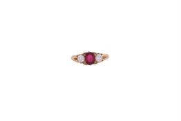 AN 18 CARAT GOLD RUBY AND DIAMOND THREE STONE RING LONDON 1998