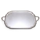 A SILVER SHAPED OBLONG TWIN HANDLED TRAY