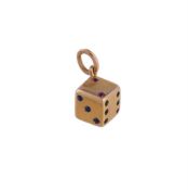 AN EARLY 20TH CENTURY GEM SET GOLD COLOURED DICE PENDANT