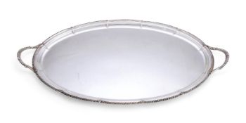 A LATE VICTORIAN SILVER SHAPED OVAL TWIN HANDLED TRAY