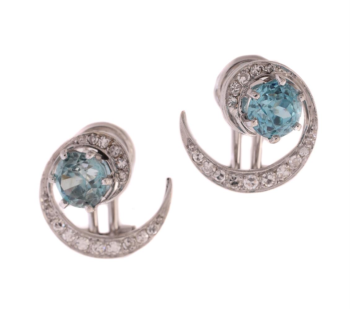 A PAIR OF MID 20TH CENTURY DIAMOND AND ZIRCON SCROLL EAR CLIPS