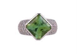 THEO FENNELL, A DIAMOND AND PERIDOT DRESS RING, LONDON 2003