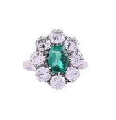 A MID 20TH CENTURY EMERALD AND DIAMOND CLUSTER RING