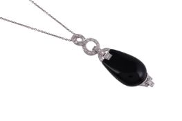 AN ONYX AND DIAMOND PENDANT