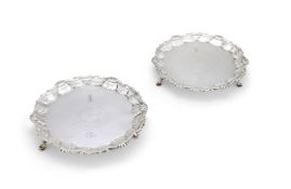 A PAIR OF GEORGE II SILVER SHAPED CIRCULAR WAITERS