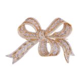 A DIAMOND BOW BROOCH