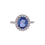 A SAPPHIRE AND DIAMOND CLUSTER RING