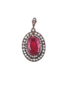 A 19TH CENTURY DIAMOND AND TOURMALINE LOCKET PENDANT