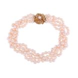 A FOUR STRAND CULTURED PEARL NECKLACE TO A GOLD COLOURED DIAMOND ACCENTED CLASP