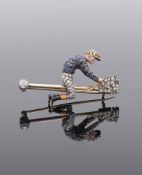 AN EARLY 20TH CENTURY SAPPHIRE, DIAMOND AND ENAMEL JOCKEY AND HOBBY HORSE BROOCH, ROTHSCHILD COLOURS