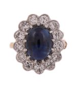 AN 18 CARAT GOLD, SAPPHIRE AND DIAMOND CLUSTER RING, LONDON 1987