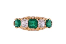 A LATE VICTORIAN EMERALD AND DIAMOND FIVE STONE RING
