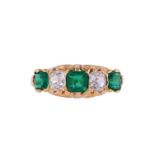 A LATE VICTORIAN EMERALD AND DIAMOND FIVE STONE RING