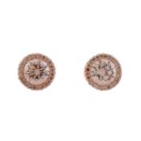 A PAIR OF TINTED DIAMOND CLUSTER EAR STUDS