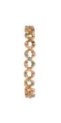 A VICTORIAN TURQUOISE AND HALF PEARL SPRUNG BRACELET, CIRCA 1880