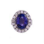 A TANZANITE AND DIAMOND CLUSTER RING