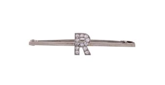 A DIAMOND SET INITIAL BAR BROOCH FIRST HALF OF THE 20TH CENTURY
