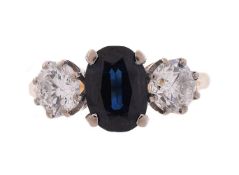 A SAPPHIRE AND DIAMOND THREE STONE RING