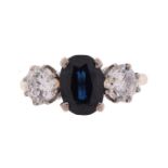 A SAPPHIRE AND DIAMOND THREE STONE RING