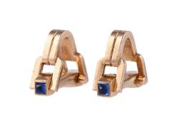 A PAIR OF 1970S SAPPHIRE AND GOLD COLOURED STIRRUP SHAPED CUFFLINKS