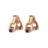 A PAIR OF 1970S SAPPHIRE AND GOLD COLOURED STIRRUP SHAPED CUFFLINKS