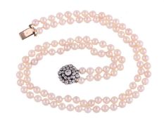 A TWO STRAND CULTURED PEARL NECKLACE TO A DIAMOND TARGET CLUSTER CLASP