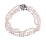 A THREE STRAND CULTURED PEARL NECKLACE WITH FRENCH DIAMOND CLUSTER CLASP