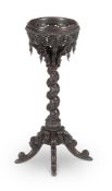 Y A CEYLONESE CARVED SOLID EBONY JARDINIERE STAND, IN THE MANNER OF THOMAS KING, MID 19TH CENTURY