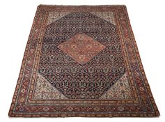 A NORTH WEST PERSIAN CARPET, approximately 371 x 261cm