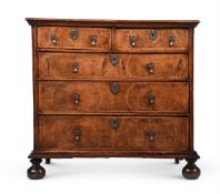 A WILLIAM & MARY WALNUT AND FEATHER BANDED CHEST OF DRAWERS, CIRCA 1690