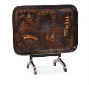A REGENCY BLACK, GILT AND POLYCHROME JAPANNED PAPIER MACHE TRAY TABLE, EARLY 19TH CENTURY
