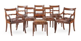 A SET OF EIGHT REGENCY MAHOGANY AND LEATHER UPHOLSTERED DINING CHAIRS, IN THE MANNER OF GILLOWS