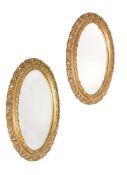A PAIR OF GILWOOD AND GESSO OVAL WALL MIRRORS, 19TH CENTURY
