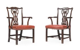 A PAIR OF GEORGE III MAHOGANY OPEN ARMCHAIRS, IN THE MANNER OF THOMAS CHIPPENDALE, CIRCA 1780