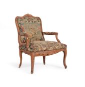 A LOUIS XV CARVED BEECH AND NEEDLEWORK UPHOLSTERED FAUTEUIL, MID 18TH CENTURY