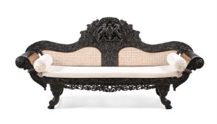 Y A CEYLONESE CARVED EBONY SETTEE, PROBABLY GALLE DISTRICT, MID 19TH CENTURY
