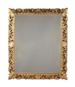 A LARGE FLORENTINE FOLIATE CARVED GILTWOOD MIRROR, SECOND HALF 19TH CENTURY