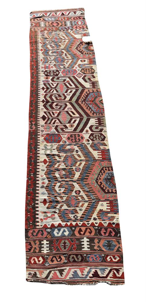 A KILIM RUNNER, CIRCA 1800, approximately 395 x 79cm