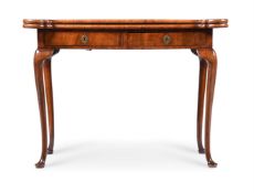 A GEORGE II FIGURED WALNUT AND FEATHER BANDED FOLDING CARD TABLE, CIRCA 1730