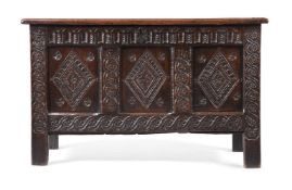 A CHARLES II PANELLED OAK CHEST, CIRCA 1660