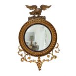 A REGENCY GILTWOOD AND GESSO CONVEX WALL MIRROR OF LARGE PROPORTIONS, EARLY 19TH CENTURY