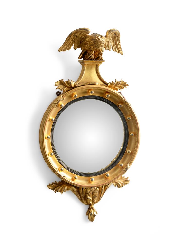 A REGENCY GILTWOOD CONVEX WALL MIRROR, CIRCA 1815