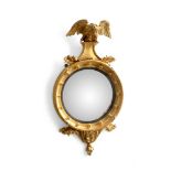 A REGENCY GILTWOOD CONVEX WALL MIRROR, CIRCA 1815