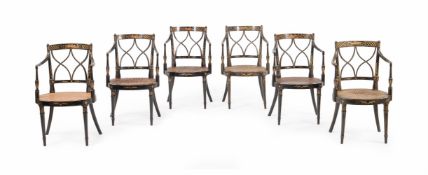 A SET OF SIX EBONISED AND PARCEL GILT ELBOW CHAIRS, EARLY 19TH CENTURY AND LATER